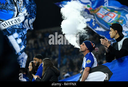 Porto, Portugal. 28th Nov, 2018. Soccer: Champions League, FC Porto - FC  Schalke 04, Group stage, Group D, 5th matchday at Estadio do Dragao: A fan  of Porto blows smoke out of