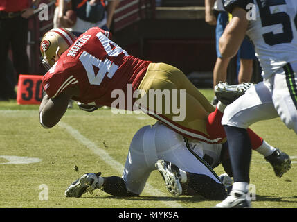 San Francisco 49ers fullback Moran Norris (L) celebrates in the endzone  after scoring on a 32-yard touchdown pass against the Denver Broncos in the  third quarter at Invesco Field at Mile High