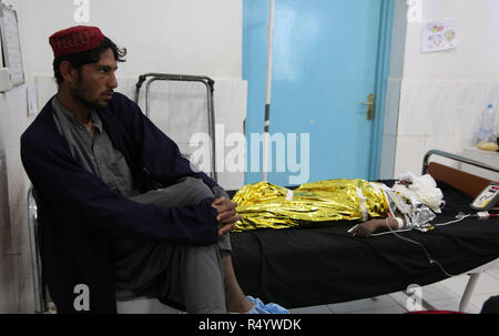Lashkar Gah, Afghanistan. 28th Nov, 2018. An injured child receives medical treatment after an airstrike at a local hospital in Lashkar Gah, capital of Helmand province, Afghanistan, Nov. 28, 2018. More than a dozen civilians were among over 30 killed in airstrikes against armed militants in Garmsir district of Afghanistan's southern Helmand province on Tuesday, an official said on the condition of anonymity on Wednesday. Credit: STR/Xinhua/Alamy Live News Stock Photo