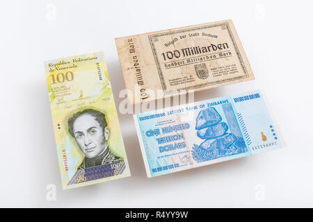 Hyperinflation - the 3 classic cases: Germany 1920s (100 Billion Marks), Zimbabwe Dollar (100 Trillion, 2008), Venezuelan 100,000 Bolivar banknote. Stock Photo