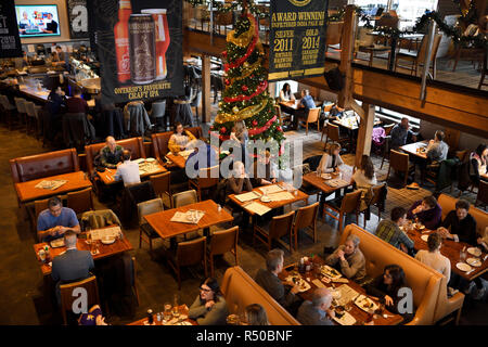 Customers at tables in restaurant bar and brewery of Amsterdam Brewhouse restaurant at Harbourfront Toronto Stock Photo