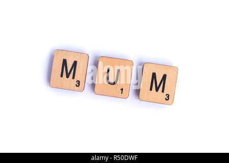 LONDON, UK - JULY 7TH 2018: The word MUM spelt with wooden letter Scrabble tiles, on 7th July 2018. Stock Photo