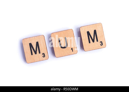 LONDON, UK - JULY 7TH 2018: The word MUM spelt with wooden letter Scrabble tiles, on 7th July 2018. Stock Photo