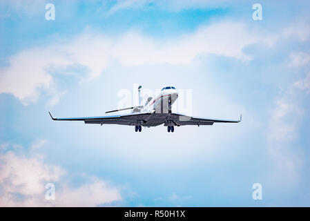 Landing of the small passenger plane at day time Stock Photo