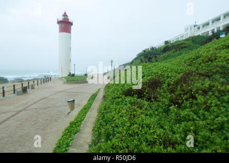 Durban, KwaZulu-Natal, South Africa, popular promenade of tourist district Umhlanga Rocks, with landmark iconic lighthouse in early morning Stock Photo