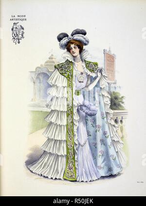Design by Doucet for Carolina â€œLa Belleâ€ Otero, a Spanish born dancer, actress and courtesan. The dress is composed of fine white muslin worn over mauve silk. There is a deep flounce pleated to the skirt and the bodice is trimmed with some rare old lace; the sash is of cÃ©ladon green ribbon. ... the large circular opera mantle ... composed of white taffetas it is entirely covered with frothy flounces of white mousseline de soie: an embroidered and jewelled stole of green velvet, spreads over her shoulders. The collar is of flounced silk muslin which also forms jabots at the edges of the st Stock Photo