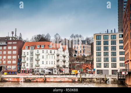 HAMBURG, GERMANY - MARCH, 2018:Buildings on the banks of the Elbe River on a cloudy end of winter day Stock Photo