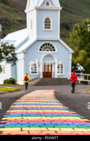 The main walking street of Seydisfjordur is painted in bright colors of the rainbow, Iceland Stock Photo