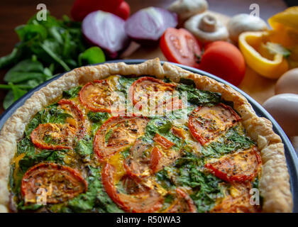 A hot quiche baked with healthy fresh vegetables and free range eggs Stock Photo
