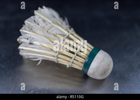 Old badminton accessories on a light table. Set for outdoor games and games. White background. Stock Photo