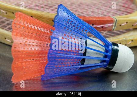 Old badminton accessories on a light table. Set for outdoor games and games. White background. Stock Photo