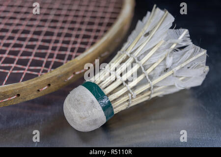 Old badminton accessories on a light table. Set for outdoor games and games. White background. Stock Photo