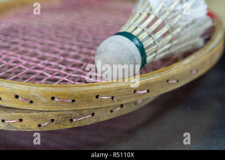 Old badminton accessories on a light table. Set for outdoor games and games. White background. Stock Photo