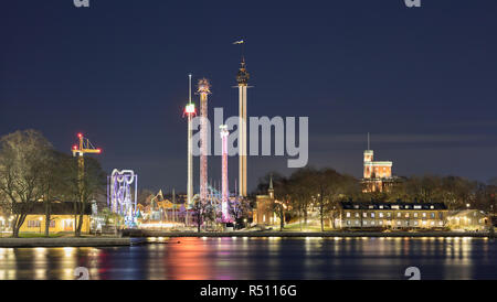 Night view at Gröna Lund tivoli over Skeppsholmen and Kastellholmen from Gamla Stan in Stockholm, Sweden Stock Photo