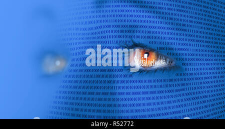 stylized person's face with the imposition of binary code with reflect the inscription 'Social Networks' in the eyes Stock Photo