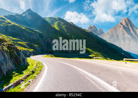road in mountains with rocky ridge in the distance. composite image. travel by car concept Stock Photo