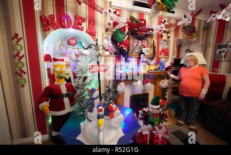 Maria Keeny, 56, inside her home in Rodsley Avenue, Gateshead which is lit up with Christmas lights, it is the 21st year her family have been putting up Christmas lights inside and outside the house. Stock Photo