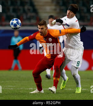 MOSCOW, RUSSIA - NOVEMBER 28: Fedor Smolov (R) of FC Lokomotiv Moscow and Serdar Aziz of Galatasaray vie for the ball during the Group D match of the UEFA Champions League between FC Lokomotiv Moscow and Galatasaray at Lokomotiv Stadium on November 28, 2018 in Moscow, Russia. (MB Media) Stock Photo