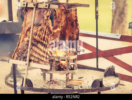 Traditional Argentinian asado roasted lamb grilled meat. Stock Photo