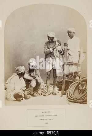 Lodhas. Low caste Hindoo tribe. Rajpootana. A group of four men with agricultural implements. J. Forbes Watson and John William Kaye, 'The People of India. A series of photographic illustrations, with descriptive letterpress, of the races and tribes of Hindustan. Volume VII' (India Museum, London, 1872). 1862. Photograph. Source: Photo 972/7(352). Language: English. Author: Shepherd and Robertson. Stock Photo