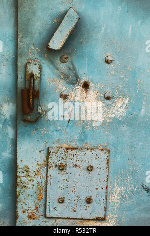 Texture of surface of rusty metal garage with cracked paint Stock Photo
