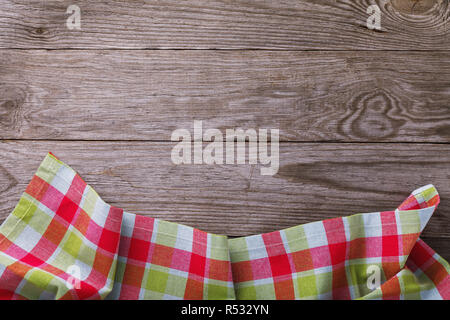 Top view on multi-colored napkin from bottom side of wooden table. Food background Stock Photo