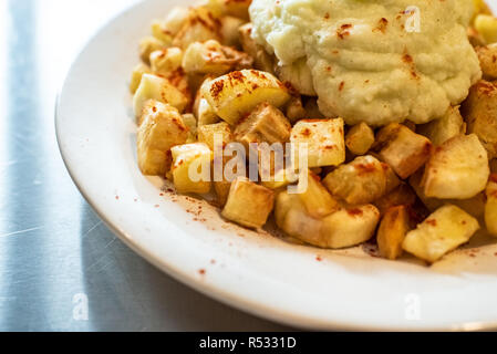 Yuca fried with hummus sauce. Stock Photo