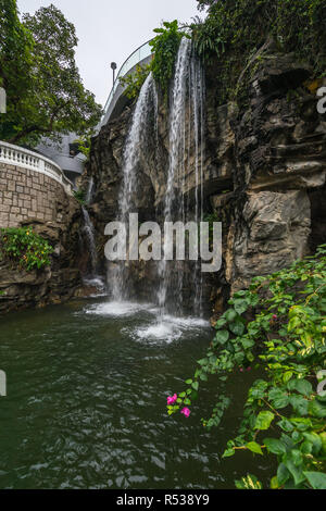 Ornamental waterfall in Hong Kong Park Stock Photo