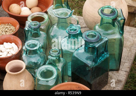 Roman glass jars and bottles to hold oils and sauces for cooking. Stock Photo