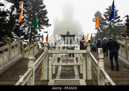 Tian Tan Buddha (Great Buddha) silhouette through the mist in a foggy day. Hong Kong, Lantau Island, January 2018 Stock Photo