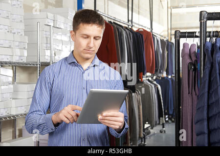 Businessman Running On Line Fashion Business With Digital Tablet Stock Photo