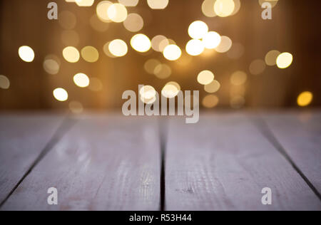 Christmas Bokeh background with empty wooden Stock Photo