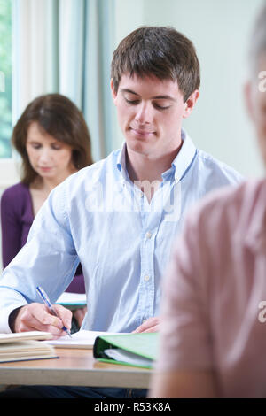 Young Man In Adult Education Class Stock Photo