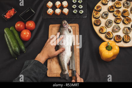 man is going to fry the fish Stock Photo