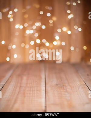 Christmas Bokeh background with empty wooden Stock Photo