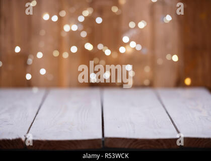 Christmas Bokeh background with empty wooden Stock Photo