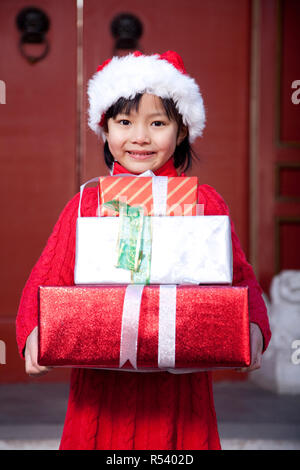 one indian girl Christmas Festival showing gift Stock Photo - Alamy