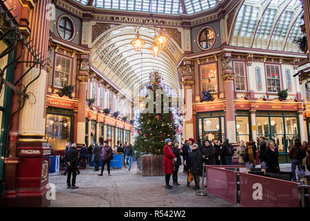 London UK. 29th November 2018. A giant decorated Christmas tree stands in Leadenhall Market  one of the oldest markets in London, dating from the 14th century which is located in the historic centre of the City of London's financial district Credit: amer ghazzal/Alamy Live News Stock Photo