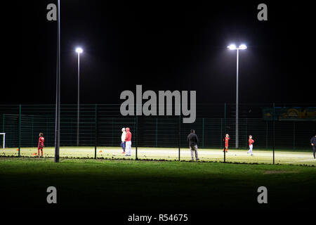 Ashford, Kent, UK. 29th Nov, 2018. UK Weather: The windy conditions haven't put off these youngsters who play and practice football under floodlights in the Hamstreet and district sports pitch facilities despite the horrible weather. © Paul Lawrenson 2018, Photo Credit: Paul Lawrenson/ Alamy Live News Stock Photo