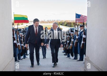 U.S. Secretary of Defense James Mattis, right, escorts Lithuanian Minister of National Defence Raimundas Karoblis on arrival at the Pentagon November 28, 2018 in Arlington, Virginia. Stock Photo