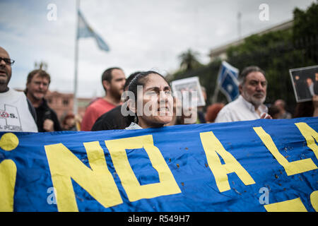 Buenos Aires, Argentina. 28th Dec, 2018. Members of the human rights organisation 'Madres de Plaza de Mayo' and left-wing groups demonstrate against the G20 summit, which will take place on 30 November and 1 December 2018 in Buenos Aires. The demonstration was also directed against the fiscal policy of the Argentine government. The IMF has pledged billion-dollar loans to Argentina. The government of the liberal President Macri is already under pressure because the country has slipped into a deep crisis with high inflation. Credit: Nicolas Villalobos/dpa/Alamy Live News Stock Photo