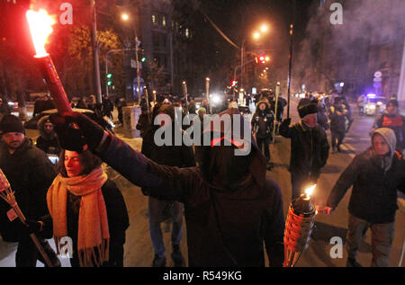 Kiev, Ukraine. 29th Nov, 2018. Activists hold torches during their torch march in Kiev, Ukraine, on 29 November 2018. Activists gathered to ask for justice for protesters killed at the EuroMaidan revolution in 2014 and investigation of crimes. Credit: Serg Glovny/ZUMA Wire/Alamy Live News Stock Photo