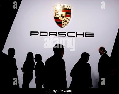 Los Angeles, USA. 28th Nov, 2018. Attendees visit the Porsche booth during the media preview at the 2018 Los Angeles (LA) Auto show in Los Angeles, the United States, Nov. 28, 2018. The LA Auto Show opens to the public on Nov. 30 and runs through Dec. 9. Credit: Zhao Hanrong/Xinhua/Alamy Live News Stock Photo