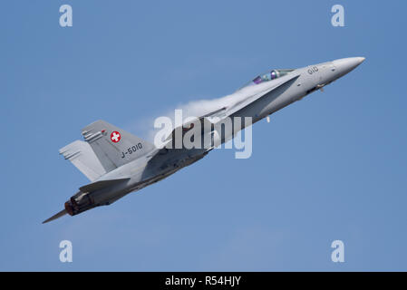 Swiss Air Force McDonnell Douglas F-18 Hornet jet fighter plane flying at the Royal International Air Tattoo RIAT airshow, RAF Fairford. Pulling air Stock Photo