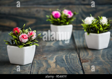 Artificial Flowers in White Flowerpots Stock Photo