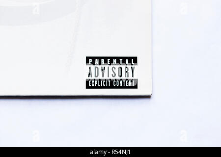 Close up of Parental Advisory lable on vinyl record sleeve on white background Stock Photo