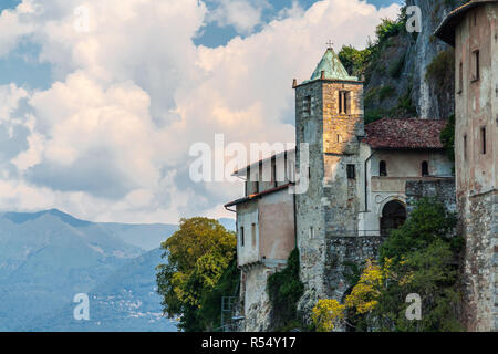 Santa Caterina Hermitage is a Catholic Monastery, perched on a cliff on the edge of Lake Maggiore, Italy. Stock Photo