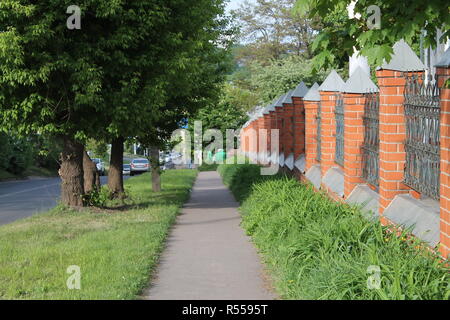 Sideway Path Curved sidewalk, path, trail at the empty street. Neighborhood scenery ...