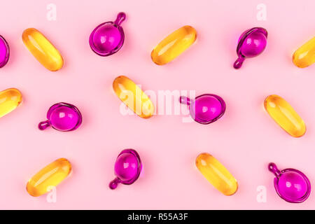 Capsules of beauty with oils, macro. Flat lay style. Two types. Stock Photo