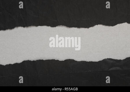 black torn paper with copy space on gray background texture Stock Photo